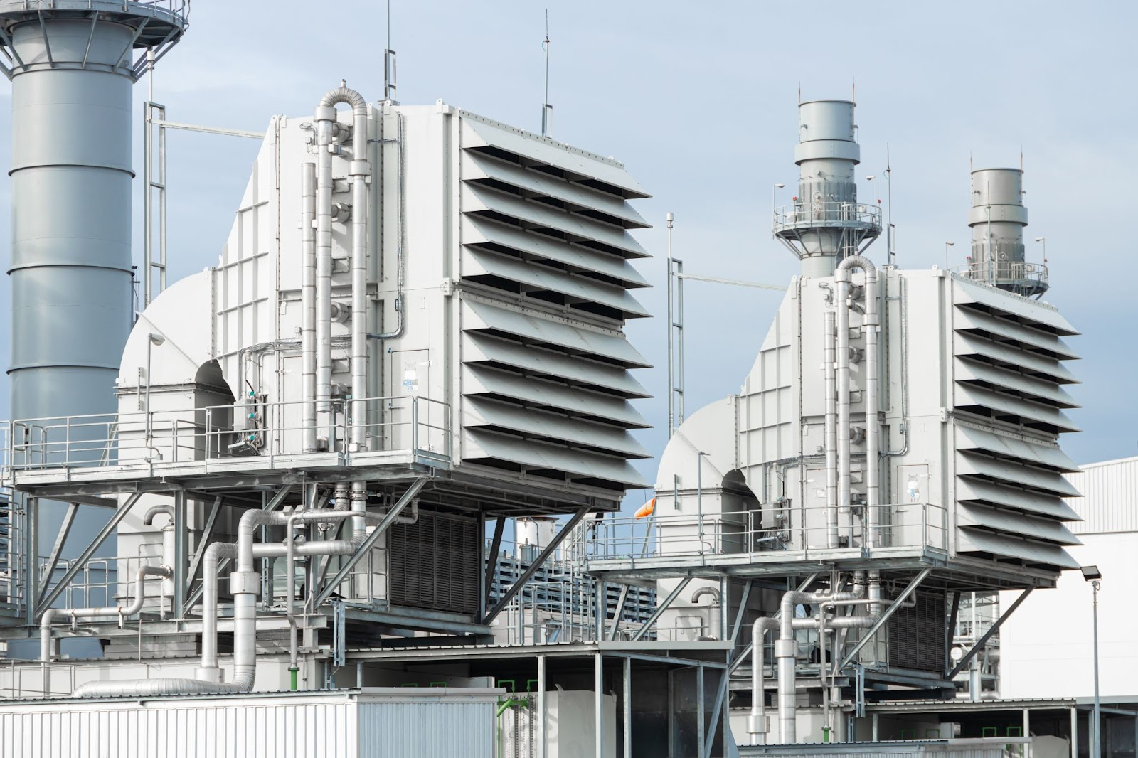 Large industrial electrostatic precipitators at a power plant, showing a complex emission control structure.